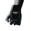 Black Drakkar Noir Guy Laroche perfume bottle held by a hand on a white background