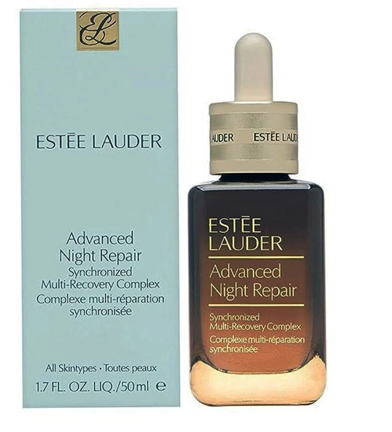 Estée Lauder Advanced Night Repair skincare set, featuring a light blue outer box and a dark brown glass dropper bottle with gold lettering.