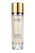 Estee Lauder Re-Nutriv Ultimate Diamond Transformative Brillance Serum in a clear glass bottle with a shiny gold cap, shown on a solid white background.