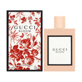 Gucci Bloom perfume bottle and packaging with floral design
