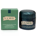 La Mer night cream jar and packaging on a white background