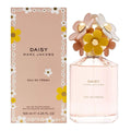 Marc Jacobs Daisy Eau So Fresh perfume bottle and packaging with floral design.